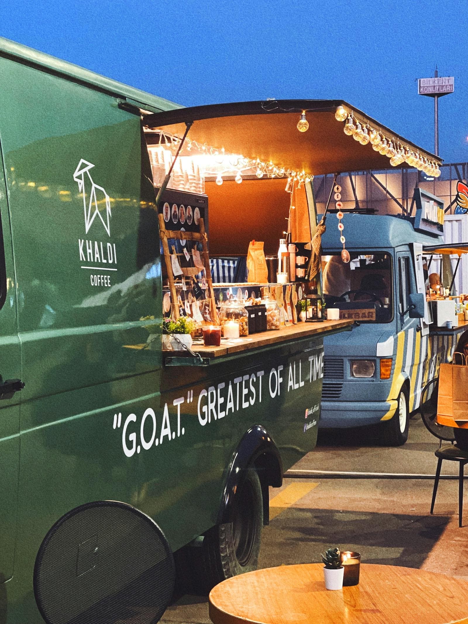 Colorful food trucks at an evening festival