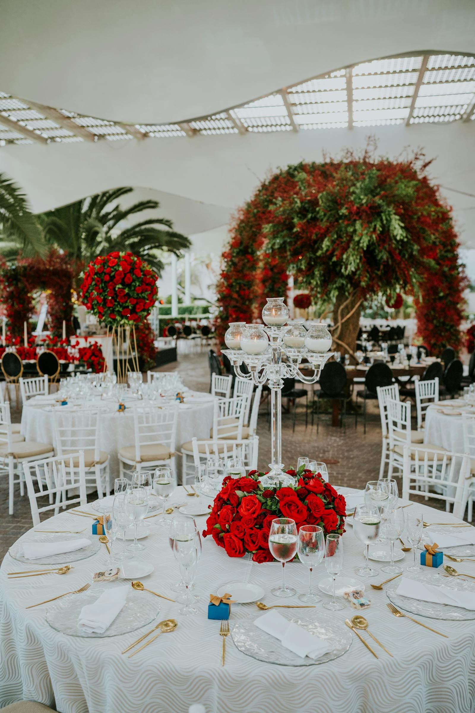 Elegant outdoor wedding reception with floral arrangements