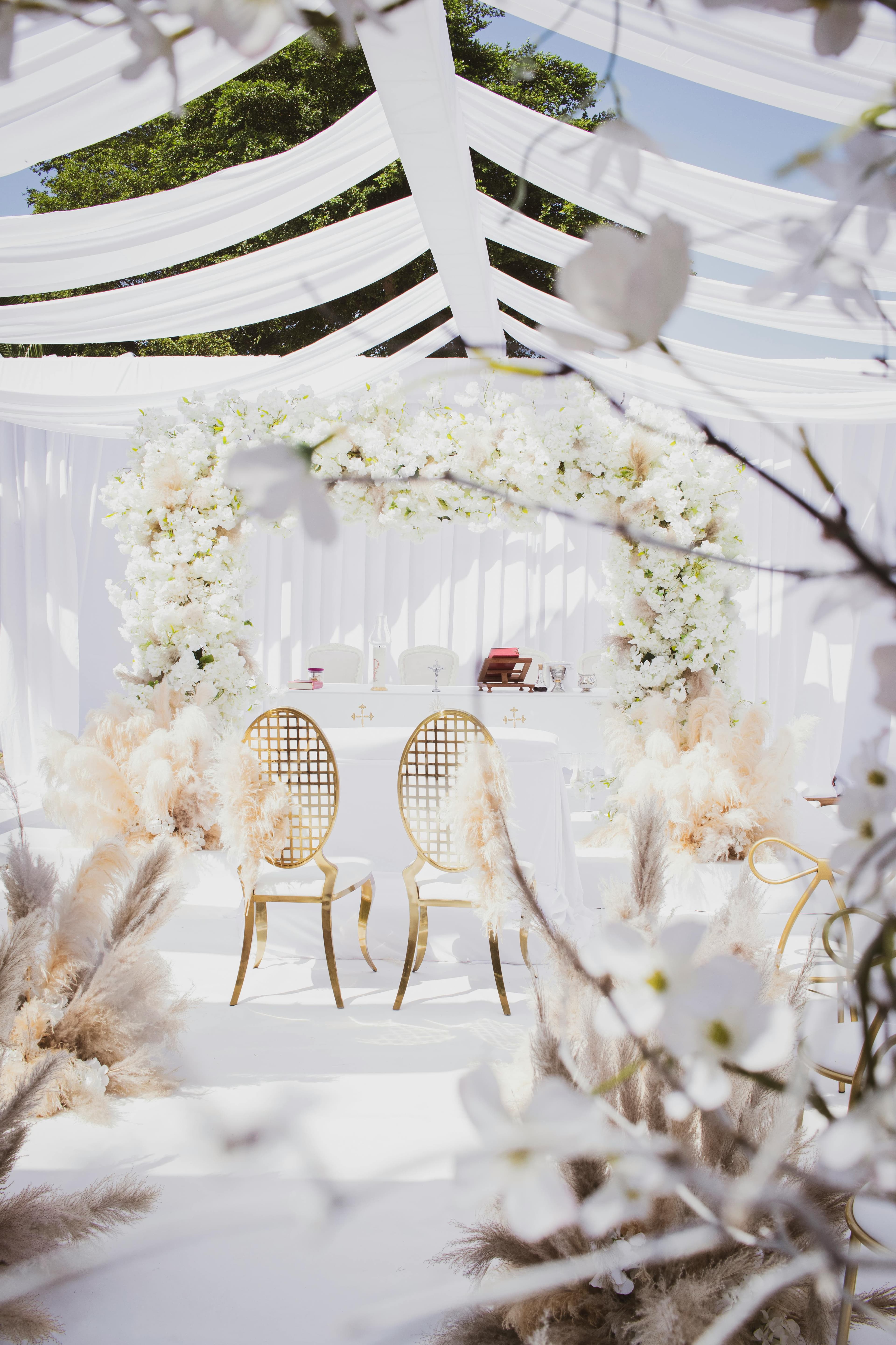 An elegant white-themed wedding reception setup